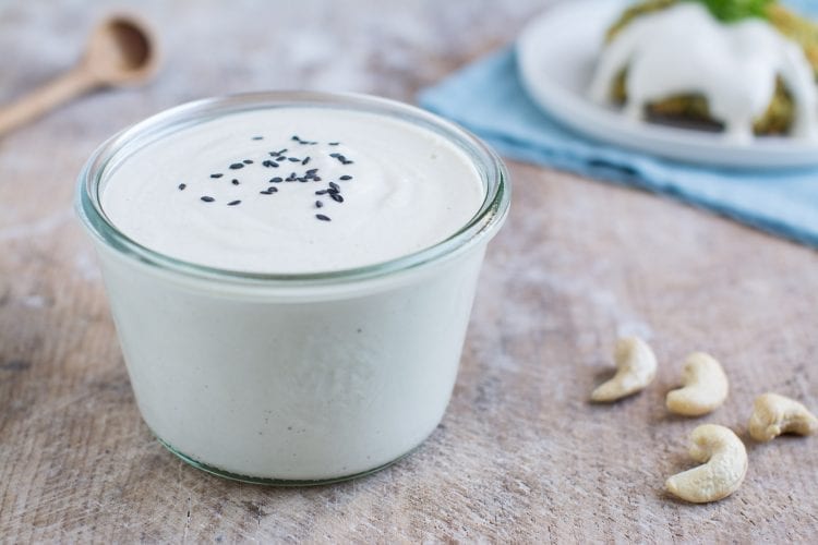 Vegan oil-free and gluten-free cashew sour cream that is quick to make and serves perfectly as dairy-free salad dressing or vegan mayonnaise in Russian potato salad.