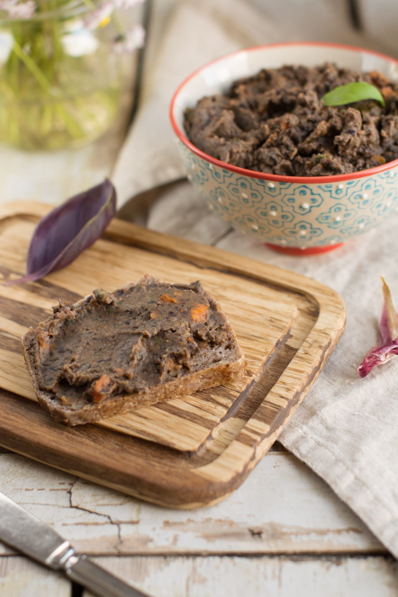 Oil-free black bean hummus with oven-roasted veggies and basil