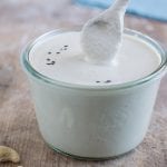 Vegan oil-free and gluten-free cashew sour cream that is quick to make and serves perfectly as dairy-free salad dressing or vegan mayonnaise in Russian potato salad.