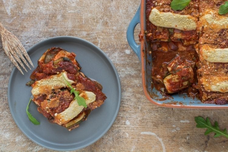 Superbly flavourful vegan tomato zucchini casserole with mozzarella that is oil-free and gluten-free. Excellent Mediterranean vegan recipe for side dish or main meal.