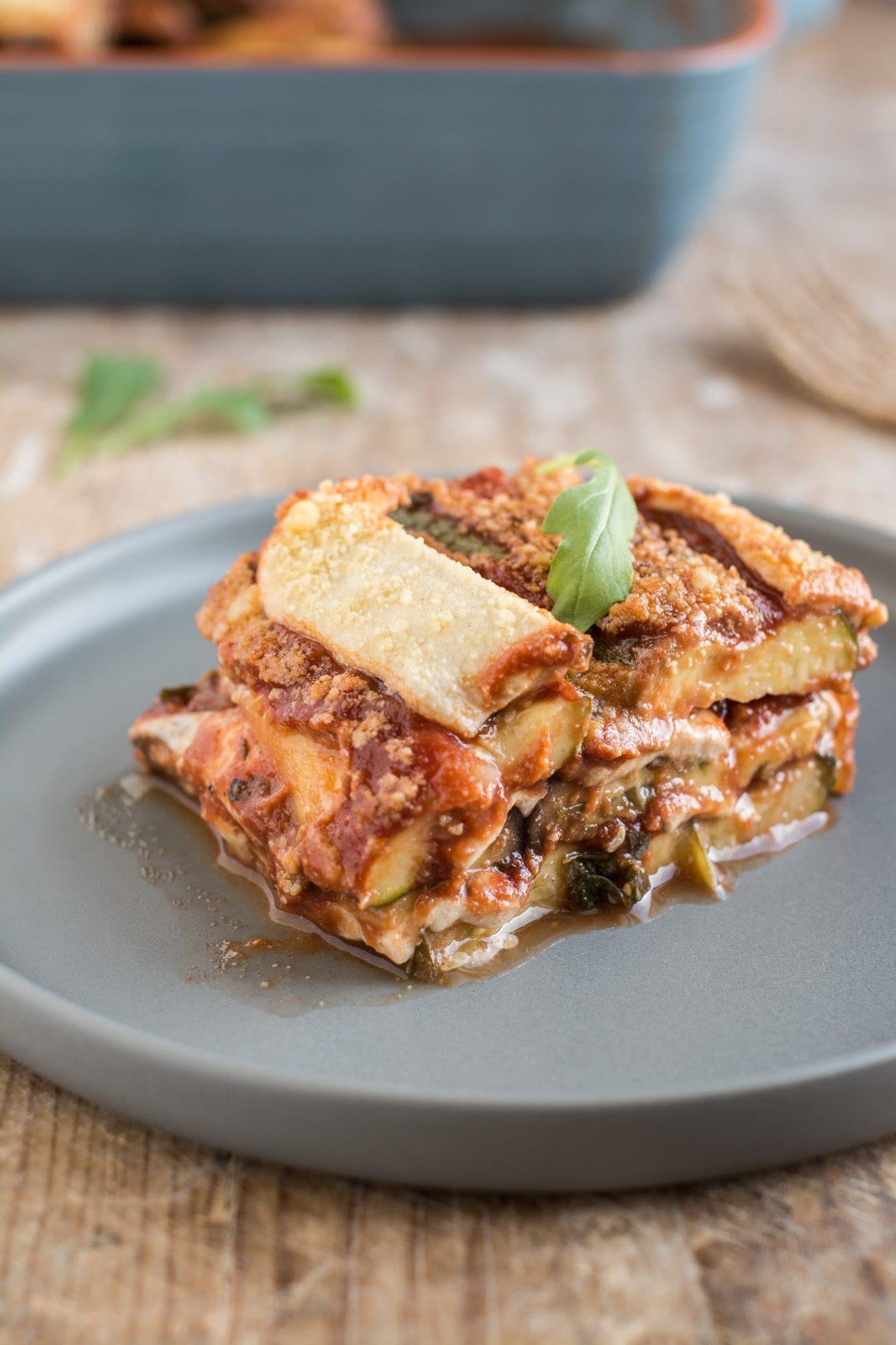 Superbly flavourful vegan tomato zucchini casserole with mozzarella that is oil-free and gluten-free. Excellent Mediterranean vegan recipe for side dish or main meal. 