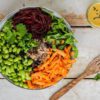 Learn how to make a filling balanced low glycemic vegan Buddha bowl with buckwheat, edamame beans, carrot, beetroot, and lettuce. And pour it over with a delicious oil-free salad dressing.