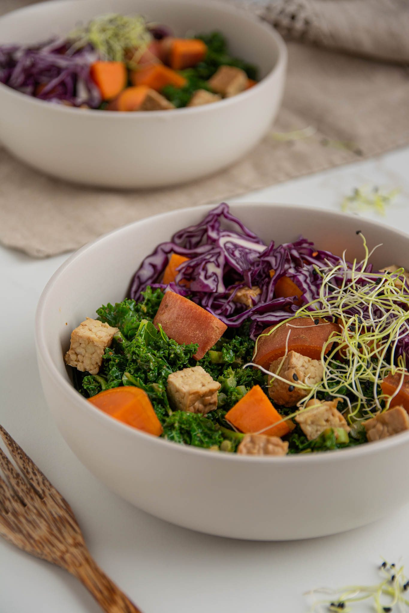 Any fan of kale will enjoy this healthy and delicious massaged kale salad that is ready in under 30 minutes. Steamed and massaged kale paired with sweet potatoes and tempeh makes a filling and nourishing plant-based meal. Using steamed kale for greater antioxidant capacity.