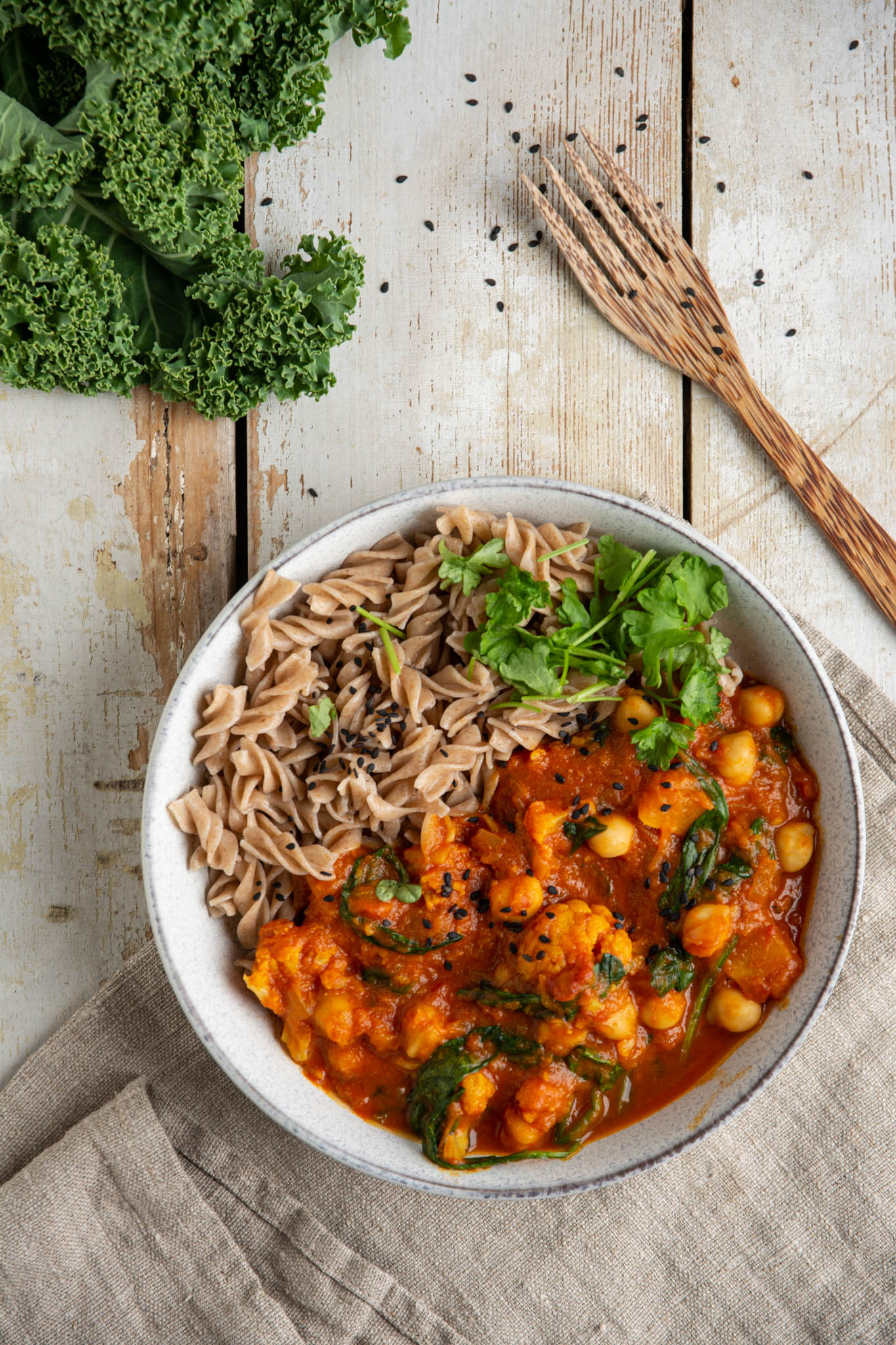 Learn how to make the heartiest and most comforting pumpkin curry with cauliflower and tomatoes. This quick and easy recipe is plant-based, oil-free, low-fat, and gluten-free.