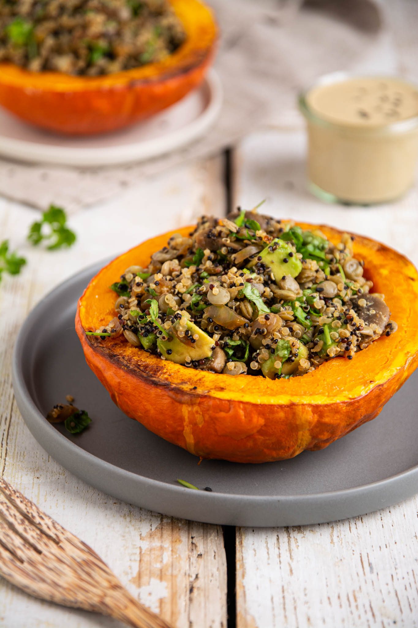 Learn how to make delicious and hearty festive vegan stuffed pumpkin with lentils, quinoa, and mushrooms. Moreover, my creamy and herby cashew-miso dressing will make this dish extra luscious.