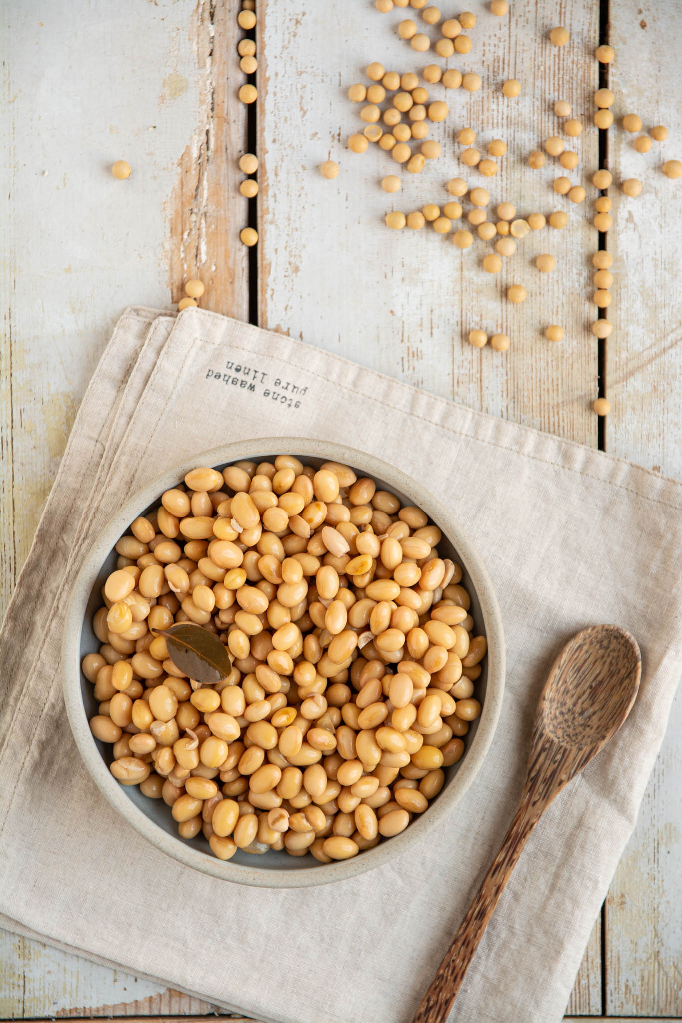 Learn how to cook soybeans at home in a regular pot or a saucepan. Use the cooked soybeans for high protein hummus, in soups, stews, and salads, or nibble on them as they are.