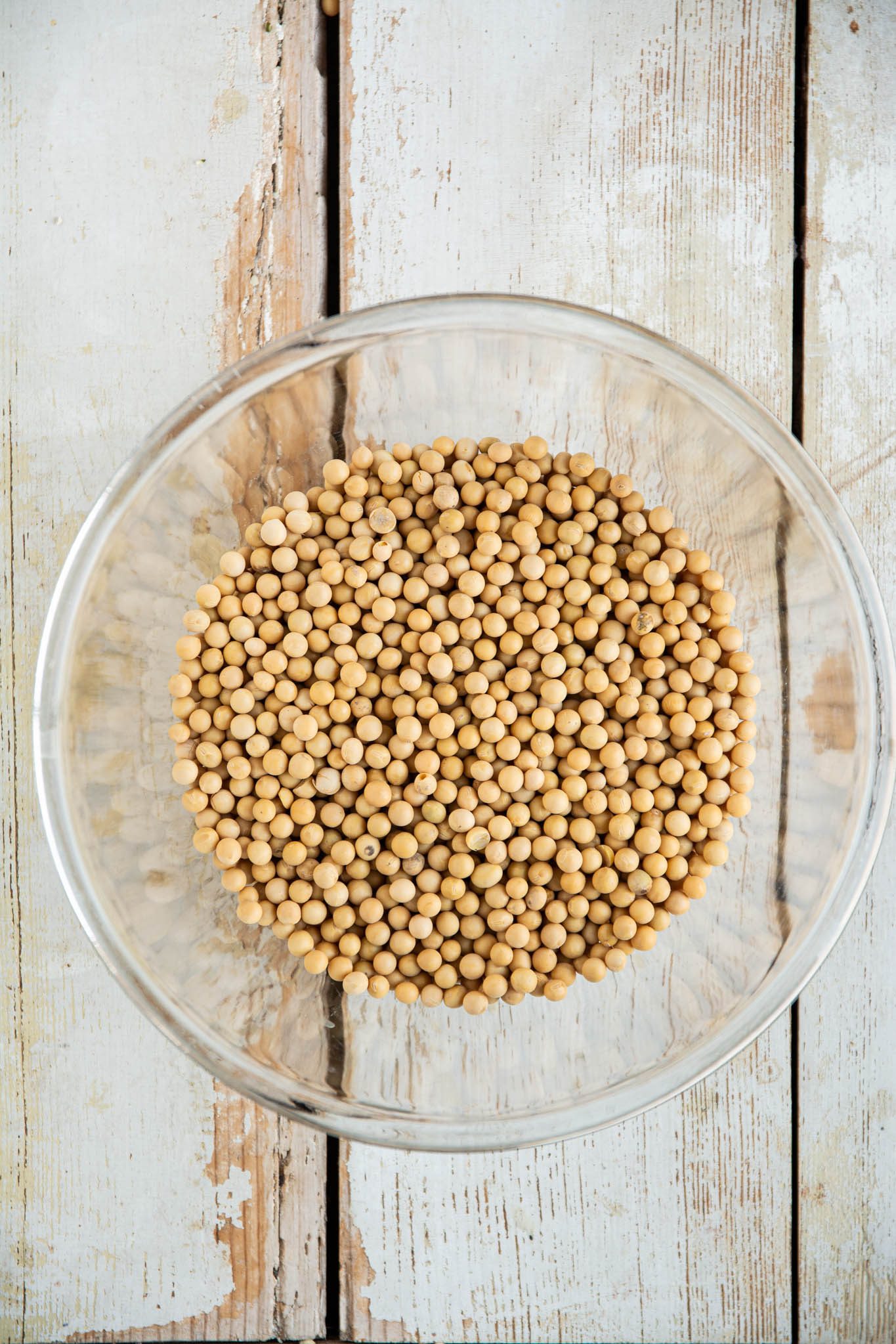 Learn how to cook soybeans at home in a regular pot or a saucepan. Use the cooked soybeans for high protein hummus, in soups, stews, and salads, or nibble on them as they are.