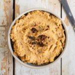 Learn how to make a delicious and easy soybean hummus recipe without tahini. Enjoy the sweetness from corn as well as the divine flavours of sun-dried tomatoes and dried basil. You’ll need 9 ingredients and a food processor to make this creamy homemade hummus.