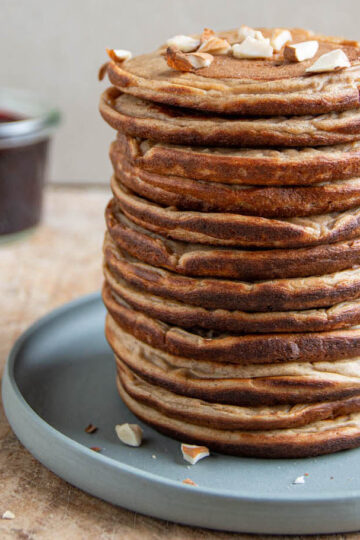 A stack of high-protein pancakes made of buckwheat, spelt, cooked soybeans, dates, oat milk.